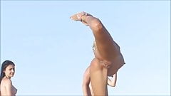 Girls on the beach with shaved pussies and nice butts.